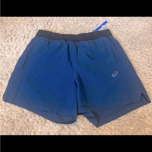 Mens blue ASICS shorts with black waist line